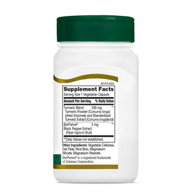 21st Century Curcuma 500mg avec Poivre Noir près d'un verre d'eau