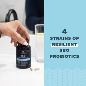 Ancient Nutrition SBO Probiotics capsules on a wooden table