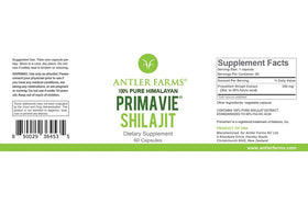 Antler Farms PrimaVie Shilajit 60 capsules sur un bureau avec des plantes