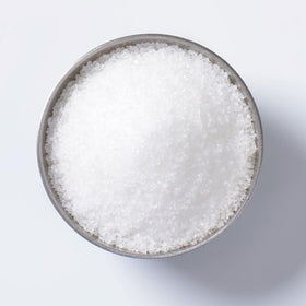 Bicarbonate de potassium 10oz avec des plantes en arrière-plan