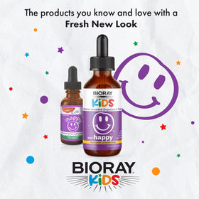 BIORAY Kids NDF Happy mise en scène sur une table avec jouets d'enfants