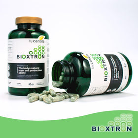 Bioxtron Complément Alimentaire sur une table en bois