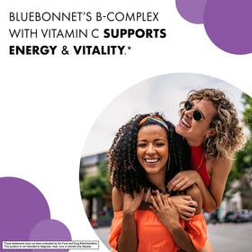BlueBonnet B-Complex capsules à côté d'un verre d'eau