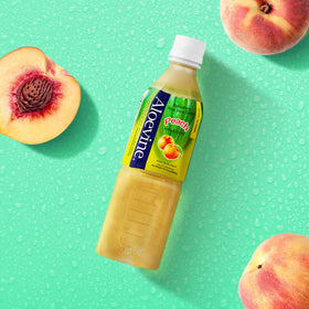 Boisson Aloe Vera Aloevine à la pêche servie dans un verre