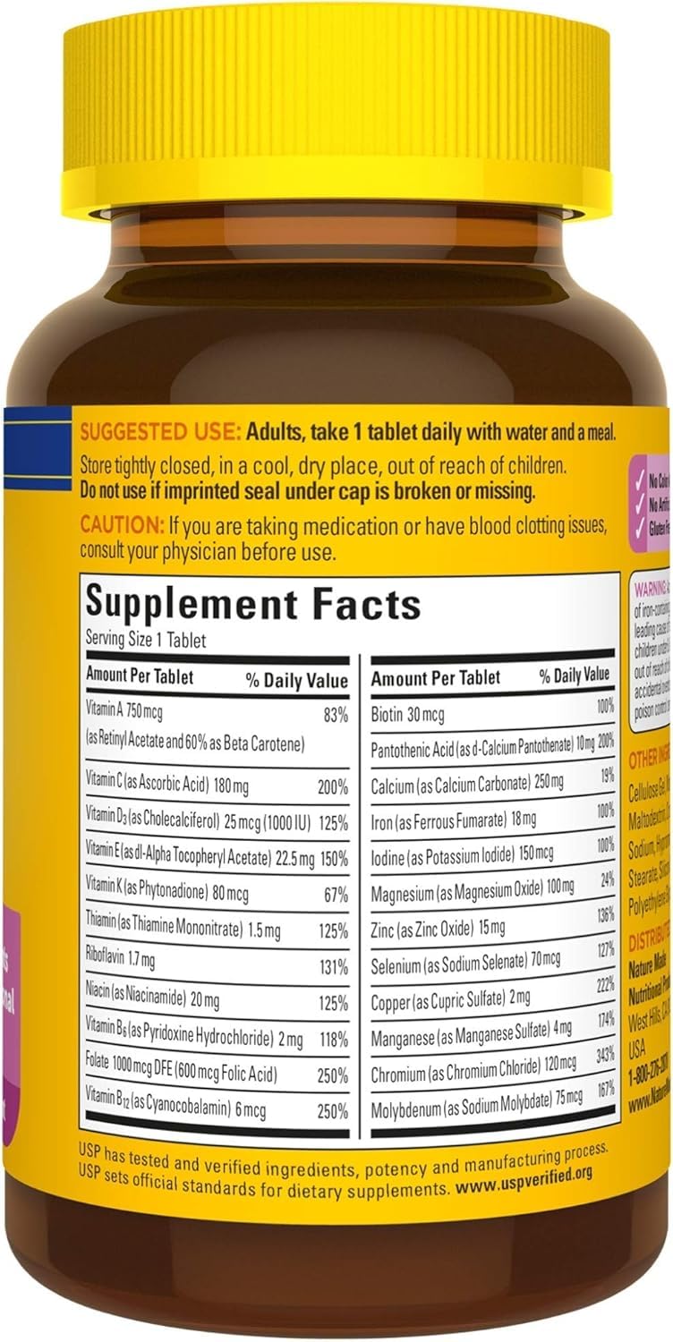 Boîte de multivitamines Femme Nature Made ouverte avec des comprimés visibles