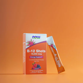 Boîte de shots B-12 NOW Foods sur une table