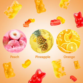 Bonbons gélifiés HOOLOO à côté d'un verre de jus de fruits