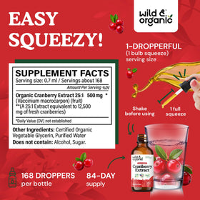 Bouteille d'extrait de canneberge Wild & Organic avec un verre à côté