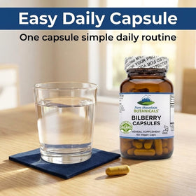 Bouteille de 60 capsules de myrtille sur une surface en bois