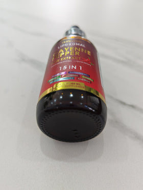 Bouteille de Complément Alimentaire Cayenne avec gouttes visibles