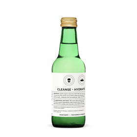 Bouteille de jus d'aloe vera Erbology avec des feuilles d'aloe vera