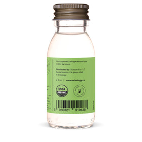 Bouteille de jus d'aloe vera Erbology avec des ingrédients frais autour