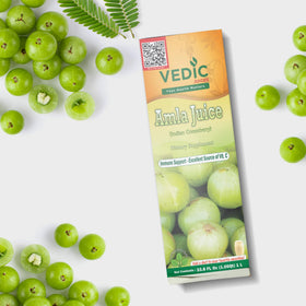 Bouteille de jus d'Amla Vedic Juices 1L avec amla en arrière-plan