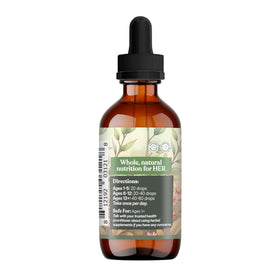 Bouteille de Nourish Her Naturally avec un verre d'eau à côté