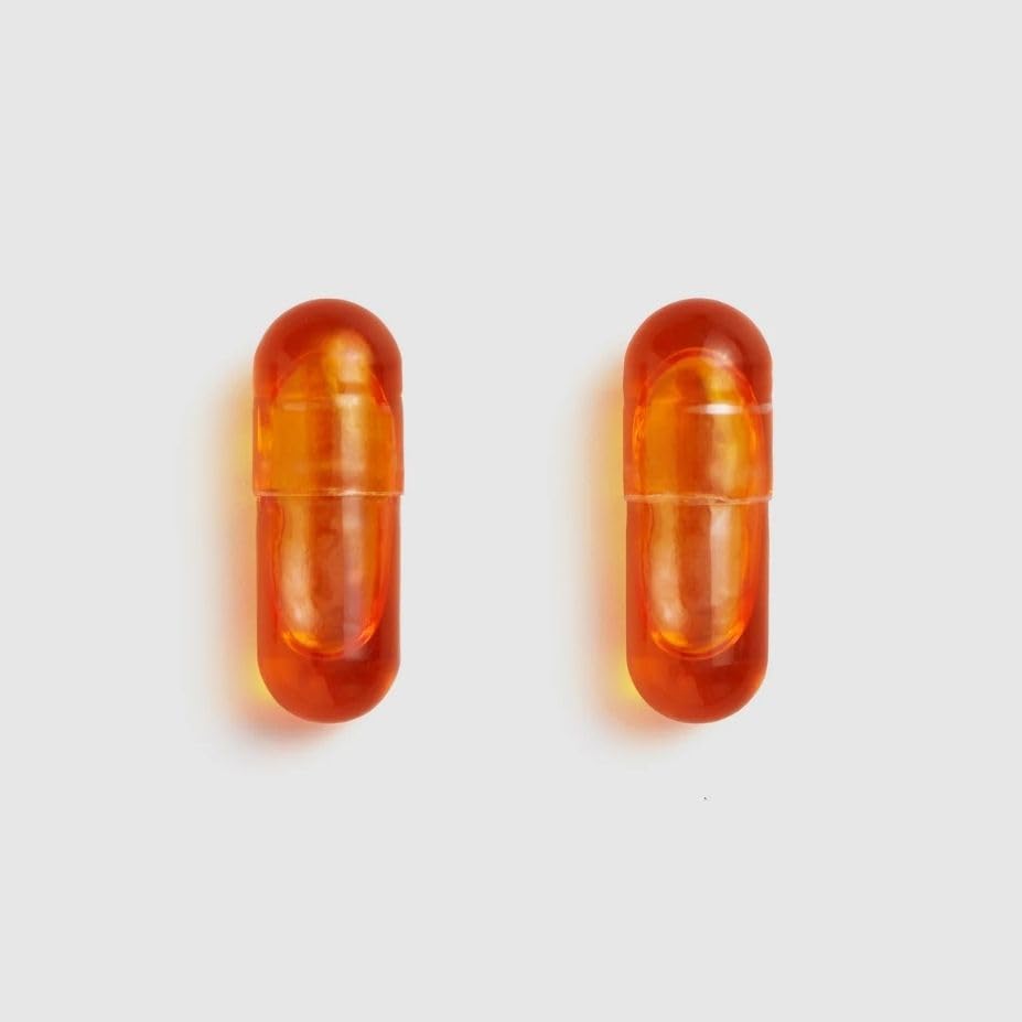 Bouteille Juice Plus+ Omega Blend ouverte avec capsules visibles
