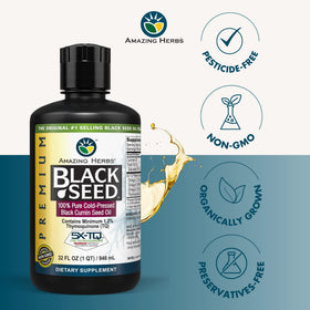 Bouteilles d'huile de graines noires Amazing Herbs sur une surface en bois