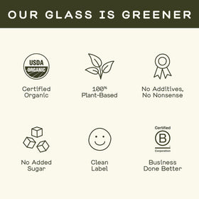 Bouteilles de shots de gingembre bio GREENHOUSE JUICE CO. sur une table