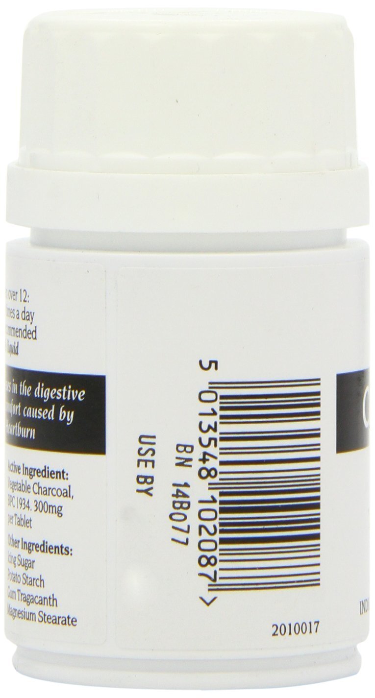Bragg Charbon Actif 300mg comprimés sur une surface blanche