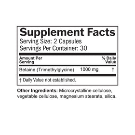BrainMD Betaine TMG capsules sur une surface blanche