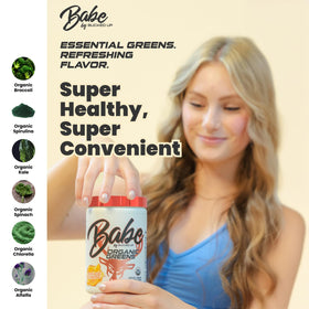 Bucked Up Greens Superfood Powder 408g in a glass of water