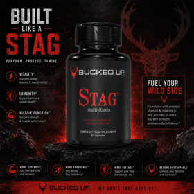 Bucked Up Multivitamines Stag sur un bureau avec des accessoires de fitness