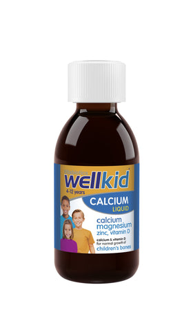 Calcium Liquide Wellkid 150ml sur une table avec des fruits frais