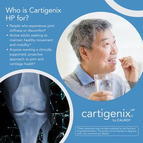 Calroy Cartigenix HP avec des capsules à côté d'un verre d'eau