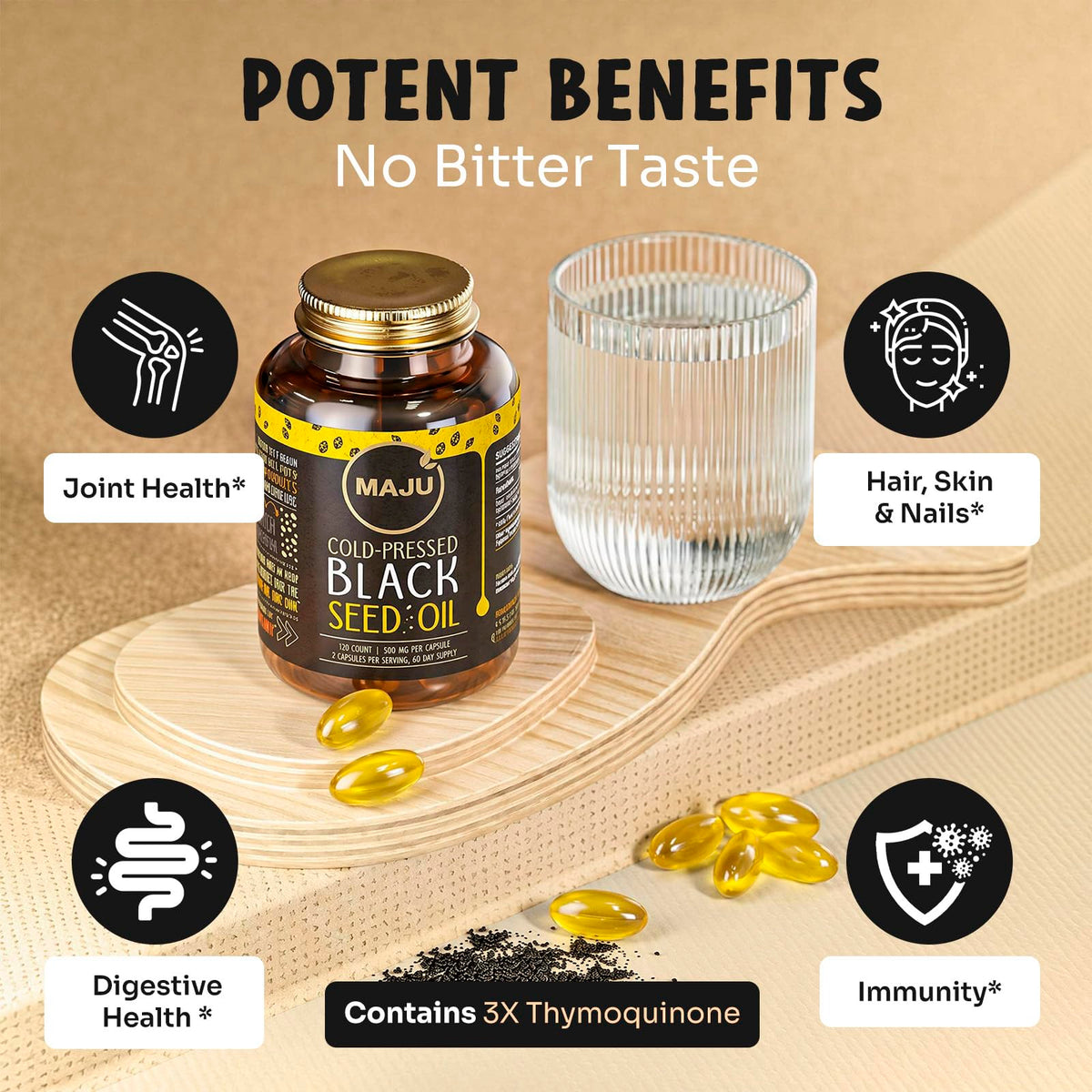 Capsule d'huile de graines noires Maju Superfoods à côté d'une cuillère