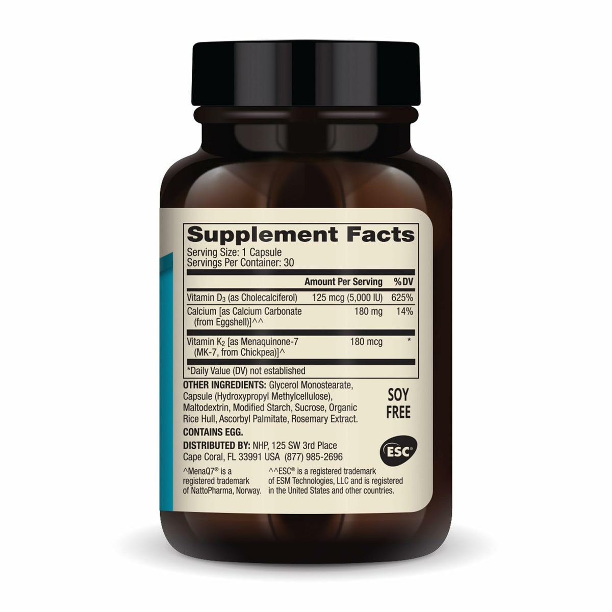 Capsule de Dr. Mercola Calcium sur une surface blanche