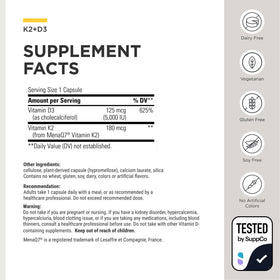 Capsule de K2 + D3 d'Integrative Therapeutics sur une surface blanche