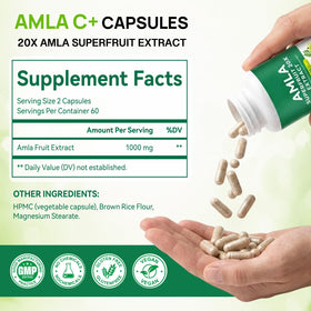 Capsules Amla UXENPHXF sur une surface blanche