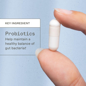 Capsules Amy Myers MD sur une surface en bois