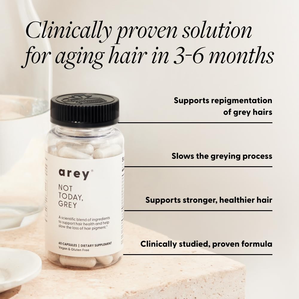 Capsules Arey Anti-Gris sur une table en bois