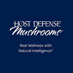 Capsules Breathe de Host Defense sur une table en bois