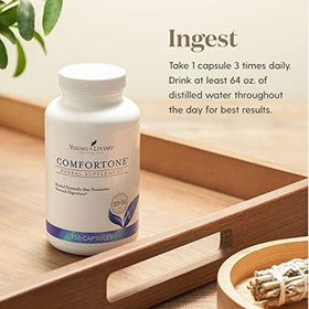 Capsules ComforTone Young Living sur une surface en bois