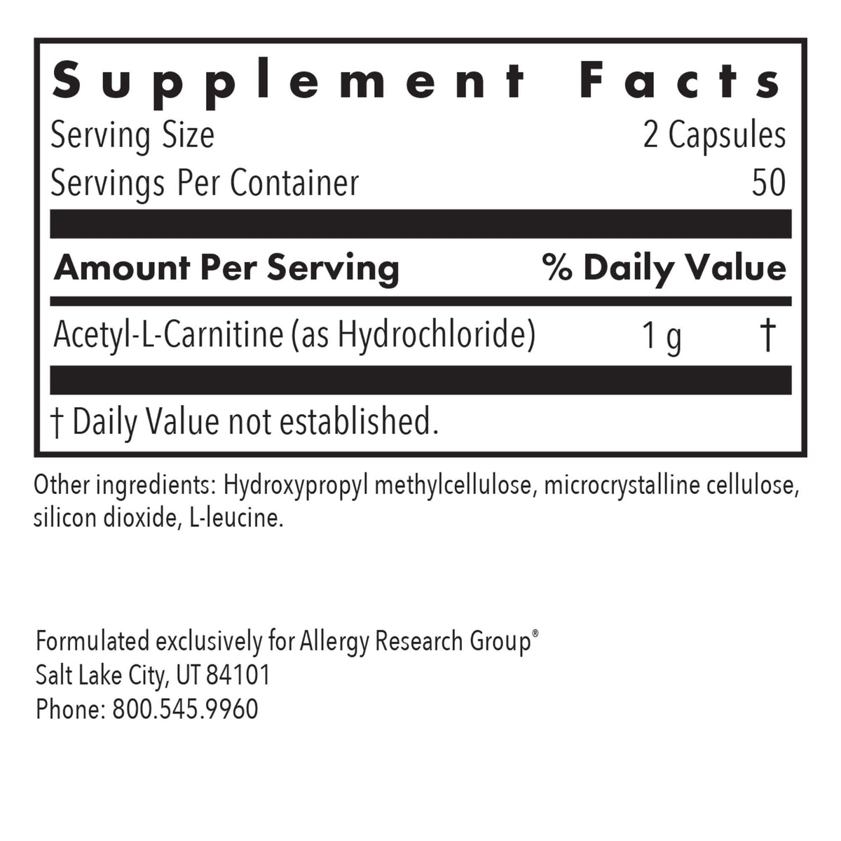 Capsules d'Acétyl L-Carnitine sur fond blanc