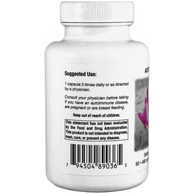 Capsules d'Astragalus sur une surface blanche