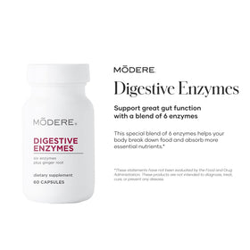 Capsules d'enzymes Modere à côté d'un verre d'eau