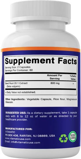 Capsules d'extrait de betterave Vitamatic à côté d'un verre d'eau