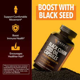 Capsules d'Huile de Nigelle HAVASU NUTRITION ouvertes avec une capsule visible