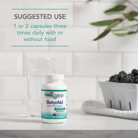 Capsules de ButyrAid d'Allergy Research Group dans un verre