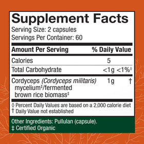Capsules de Cordyceps Host Defense sur une surface en bois