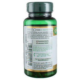 Capsules de Curcuma Nature's Bounty sur une surface blanche