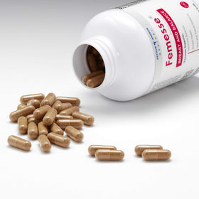 Capsules de Femesse sur une surface blanche