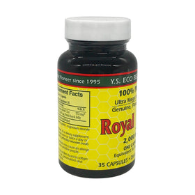 Capsules de gelée royale YS Organic avec un verre d'eau