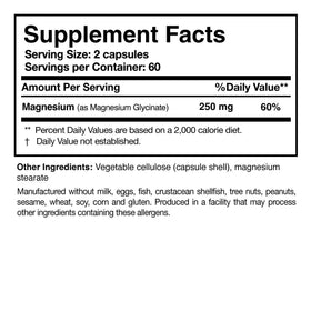 Capsules de glycinate de magnésium Researched Nutritionals en main