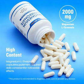 Capsules de magnésium L-thréonate de tupeou sur une surface blanche