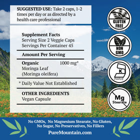 Capsules de Moringa 1000mg dans une cuillère en bois