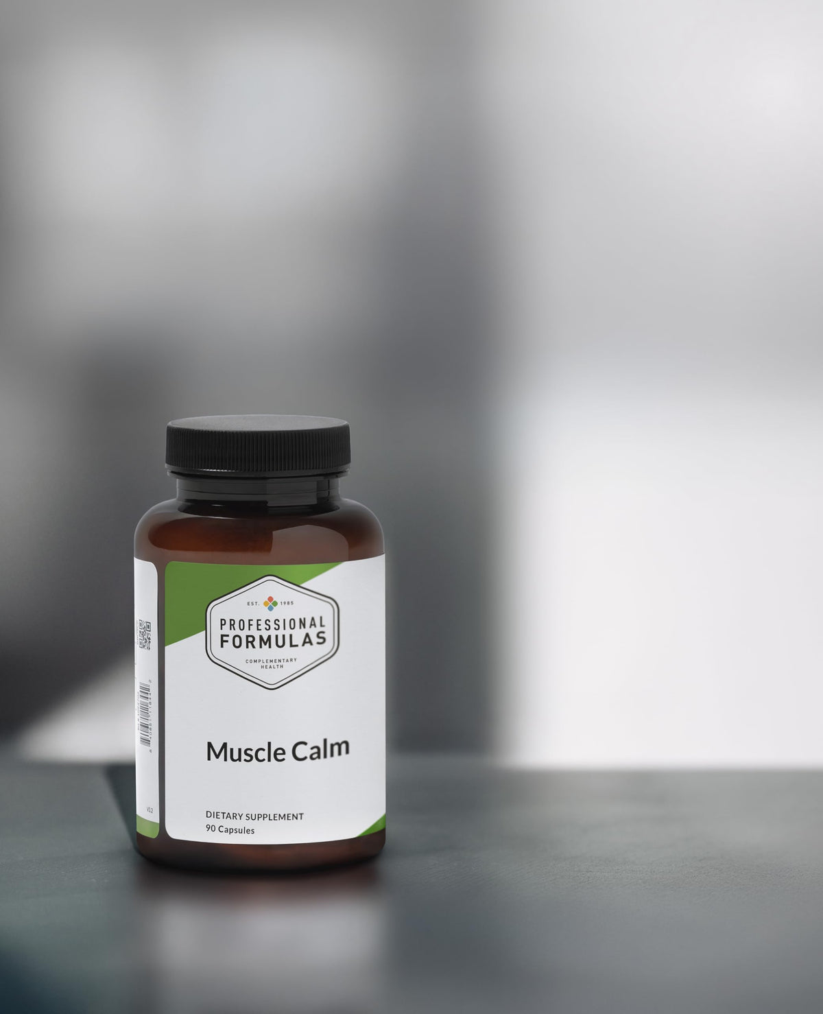 Capsules de Muscle Calm sur une surface blanche