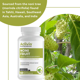 Capsules de noni Aclivia sur une table en bois